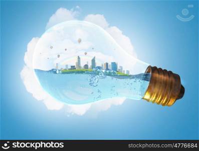Global warming concept. Glass light bulb with water and cityscape inside