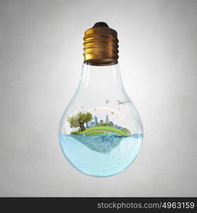 Global warming concept. Glass light bulb with water and cityscape inside