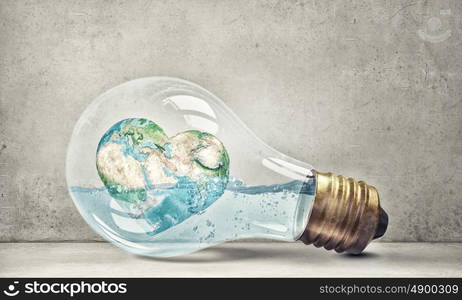 Global warming. Glass light bulb filled with water and floating Earth planet. Elements of this image are furnished by NASA