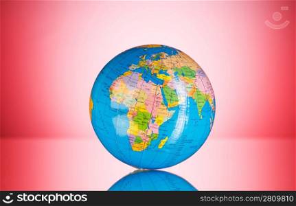 Globalisation concept - globe against gradient colorful background