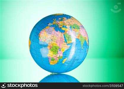 Globalisation concept - globe against gradient colorful background