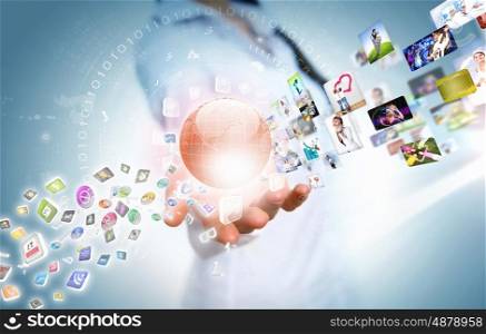 Globalization concept. Woman holding illustration of globe in hand. Media technologies