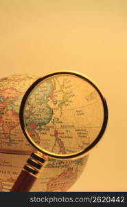 Globe and Magnifying glass