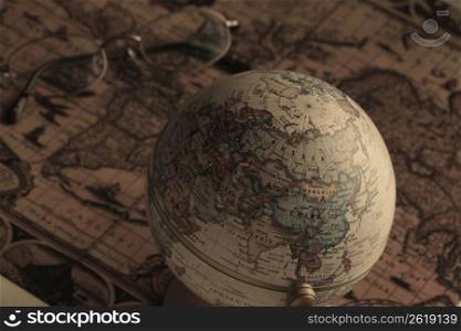 Globe and old map