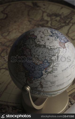 Globe and old map