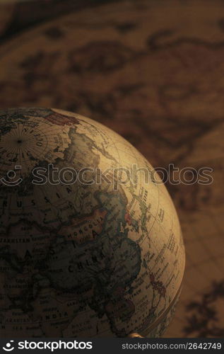 Globe and old map