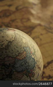 Globe and old map