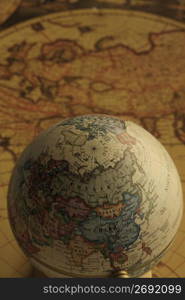 Globe and old map