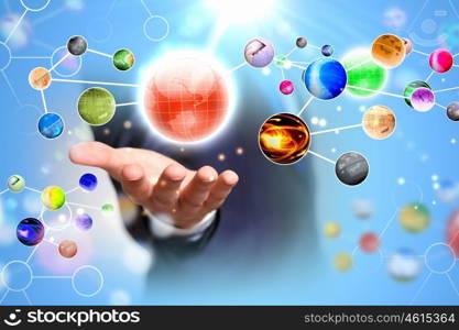 Globe in palm. Items and icons on human hand. Global technologies