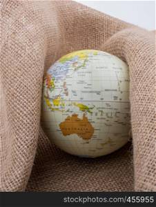 Globe is placed on canvas background