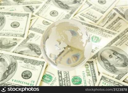 globe isolated on a dollars background