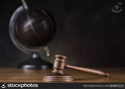 Globe, Law theme, mallet of judge, wooden gavel