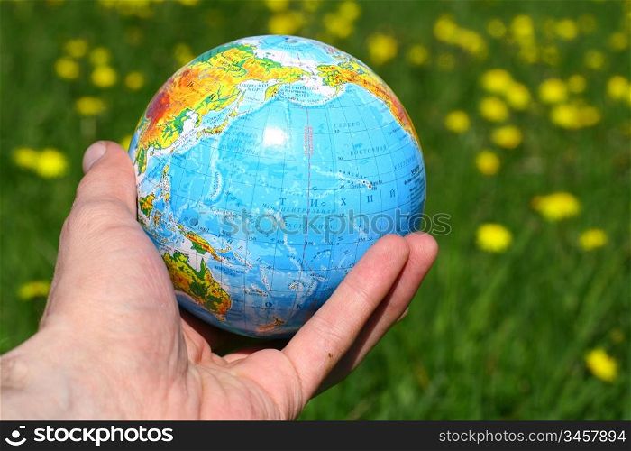 globe of planet earth in man hand