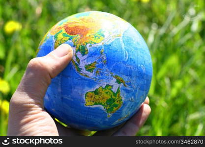 globe of planet earth in man hand