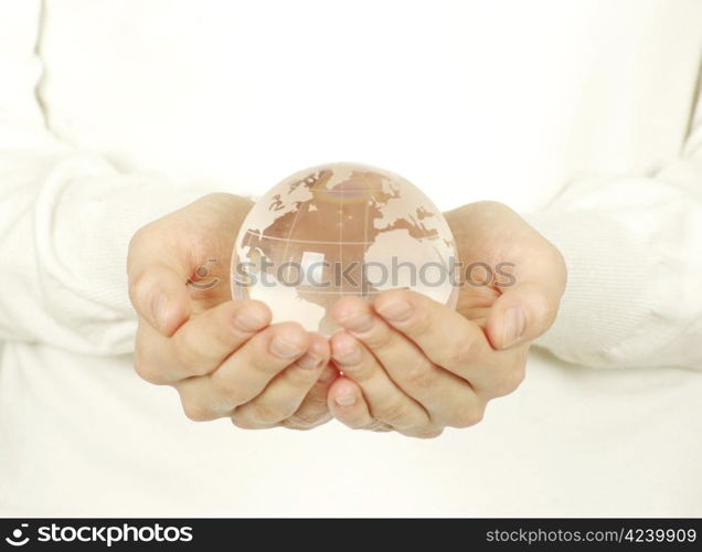 globe on the human hand on white