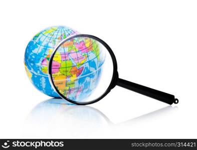 Globe under magnifying glass zooming Asia and Africa on white background