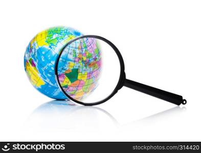 Globe under magnifying glass zooming Europe and Africa on white background