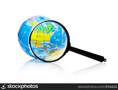 Globe under magnifying glass zooming North America, Mexico and Canada on white background