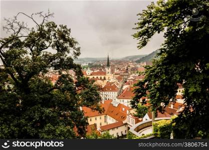 Gloomy day of rain and fog over the red roofs of Prague in the Czech Republic in Central Europe.