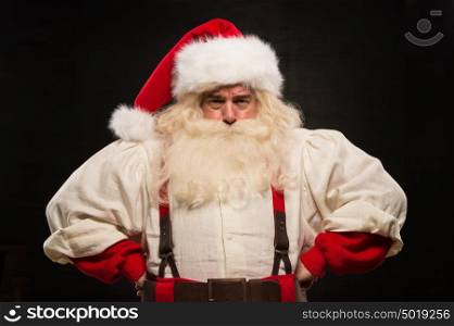 Gloomy Santa Claus portrait against dark background