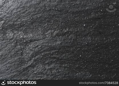 Glossy black slate background or texture.. Glossy black slate background or texture