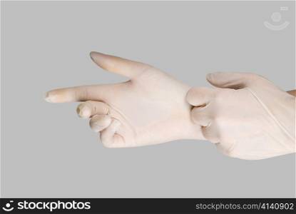 gloves on a hand on a grey background