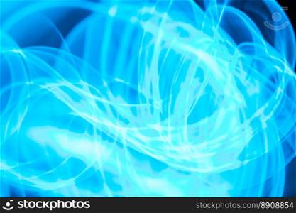 Glowing abstract curved lines.  xA Light blue colors.