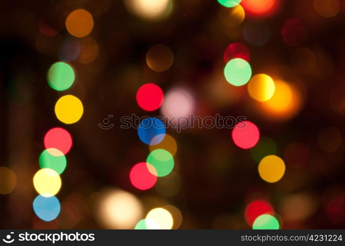 Glowing bright colourful christmas lights abstract background