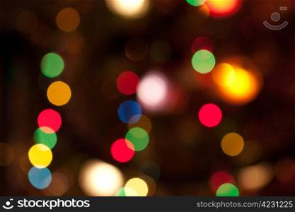 Glowing bright colourful christmas lights abstract background
