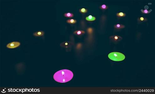 glowing colorful candles black background