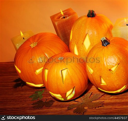 Glowing Halloween pumpkins with candles, warm autumn holiday background, traditional jack-o-lantern, night party decoration