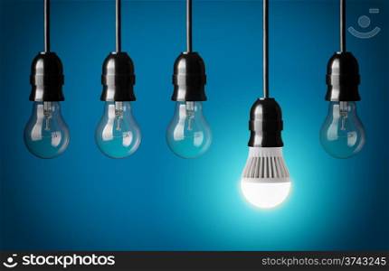 Glowing LED bulb and simple light bulbs