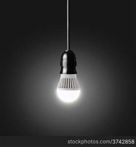 Glowing LED bulb on black