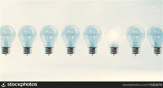 Glowing Light Bulb as a Business Idea Concept. Glowing Light Bulb