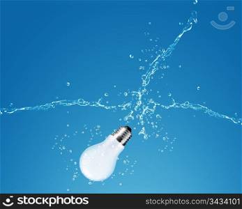 glowing Light bulb with water splash on Blue background