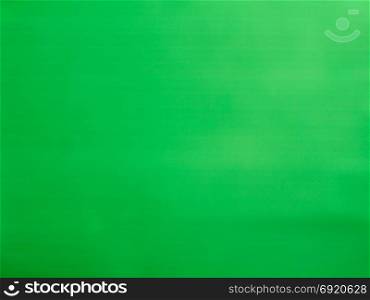 glowing neon light green glass surface background. glowing shimmering neon lights green glass surface useful as a background