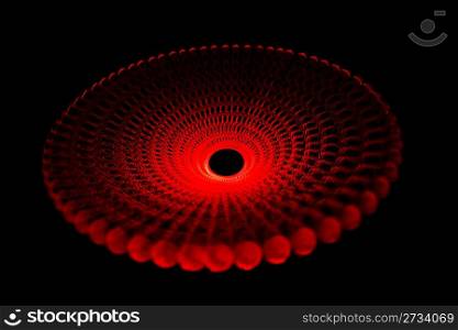 Glowing red light traces in form of disc on black background. Isolated.