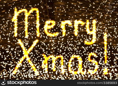 glowing words Merry Xmas over lights background, kids drawing