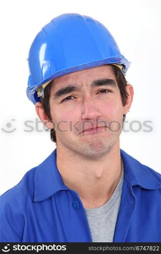 Glum construction worker