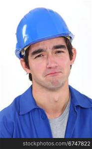 Glum construction worker