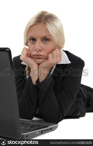 Glum woman with her laptop