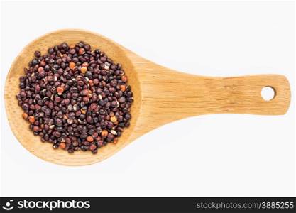 gluten free, black quinoa grain on a small wooden spoon isolated on white with a clipping path
