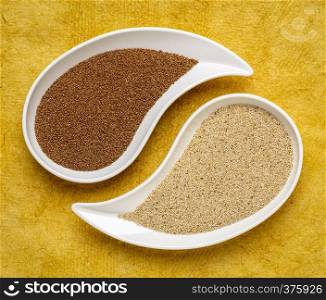 gluten free brown and ivory teff grain on teardrop shaped bowll against yellow textured paper - important food grain in Ethiopia and Eritrea