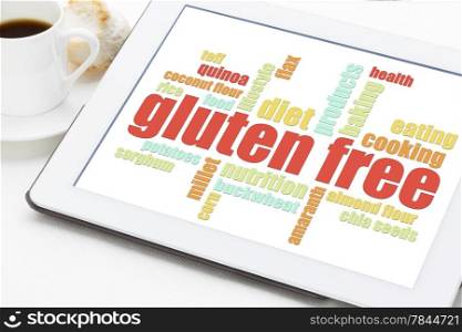 gluten free cooking word cloud on a digital tablet with a cup of coffee