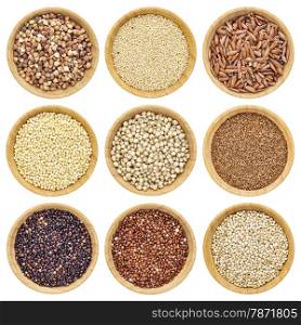gluten free grains - buckwheat, amaranth, brown rice, millet, sorghum, teff, black, red and white quinoa - isolated wooden bowls