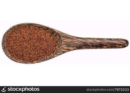 gluten free kaniwa (baby quinoa) grain on a wooden spoon isolated on white