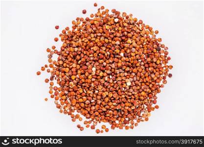 gluten free red quinoa grain - top view of a pile isolated on white