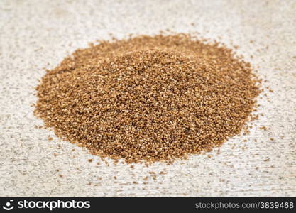 gluten free teff grain - a small pike against rustic barn wood