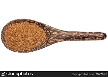 gluten free teff grain on a wooden spoon isolated on white
