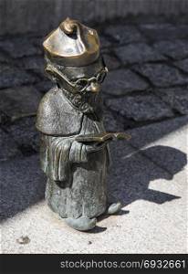 Gnome - a scientist at the entrance to the university. Wroclaw. Poland